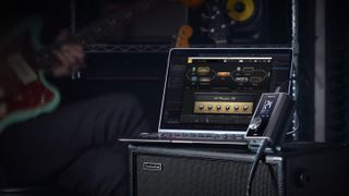 Positive Grid Riff audio interface stood against a MacBook Pro laptop with Bias FX 2 open on screen 
