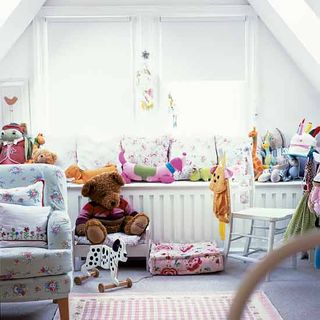 childrens room with toy and armchair