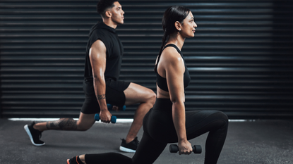 A man and a woman doing dumbbell lunges together