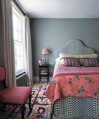 gray colored bedroom with pink furnishings
