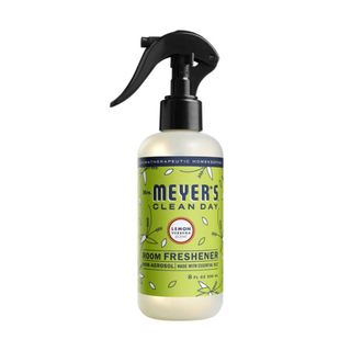 A Mrs Meyer's room spray in a white bottle with a lime colored label