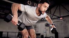 A man performing dumbbell bent over row