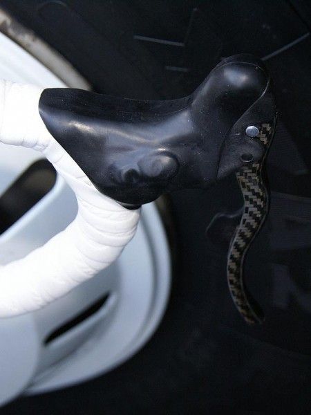 This version of the Campagnolo electronic levers also uses a button on the inner side of the body instead of the familiar thumb paddle.