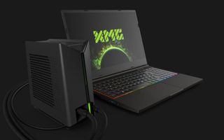 The XMG Neo 15 laptop hooked up to the XMG Oasis liquid cooling system