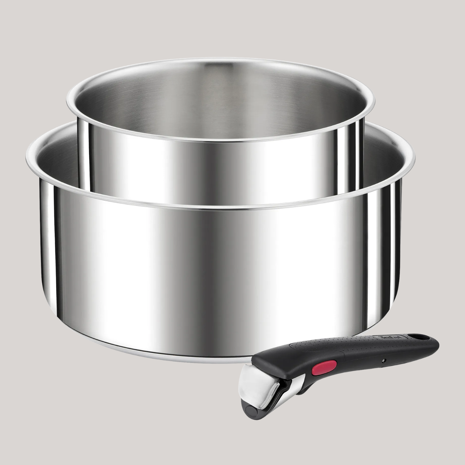 A set of two stainless steel pots with a detachable handle