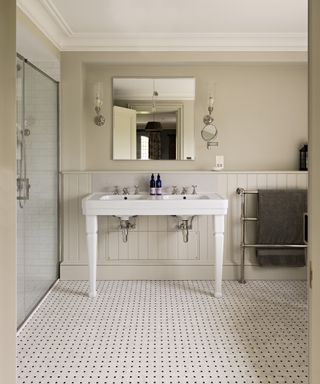 mosaic bathroom floor with white and black detail