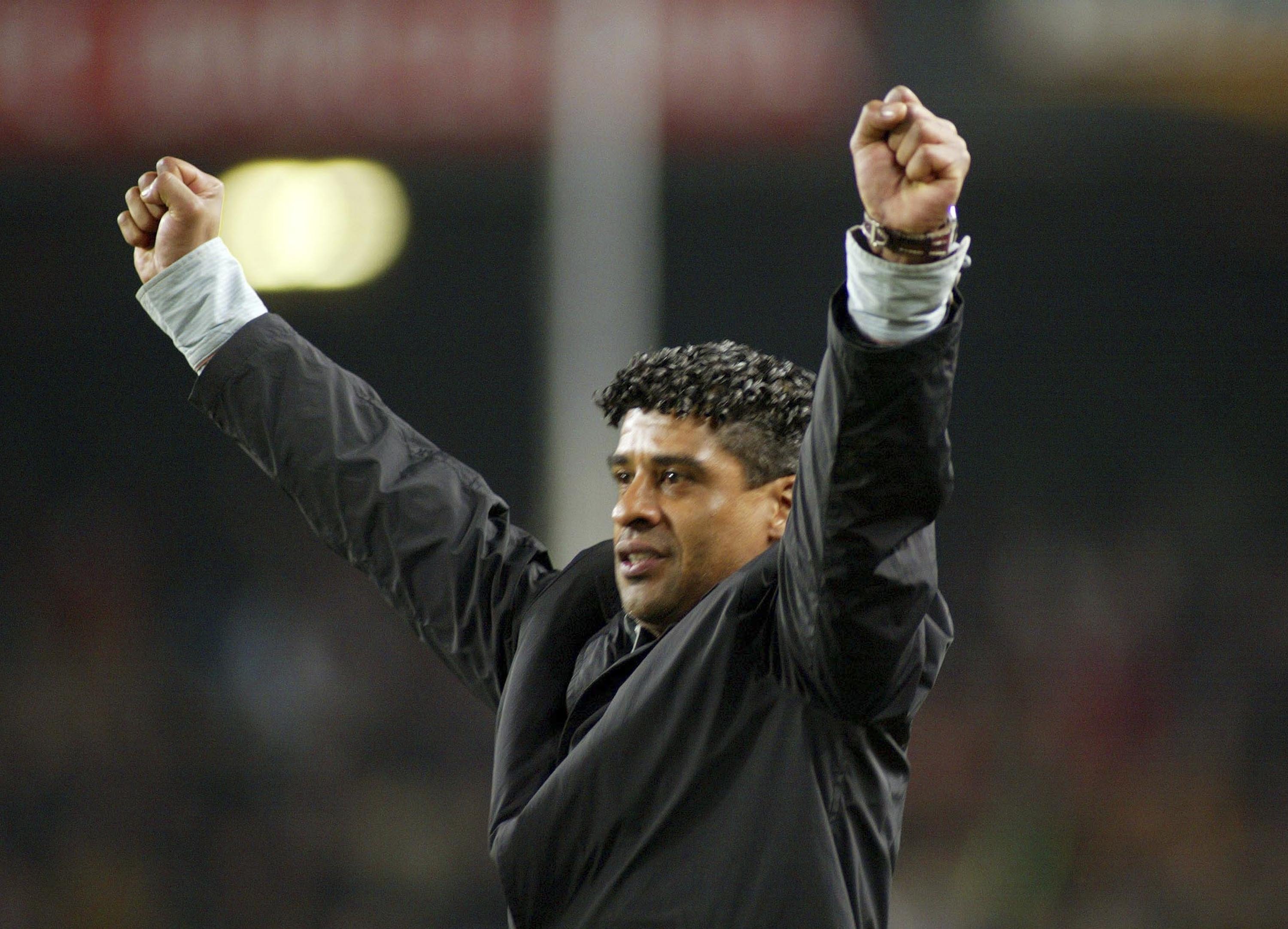 Frank Rijkaard celebrates a Barcelona goal against Alaves in January 2006.