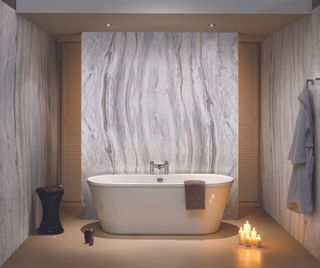 large marble effect wall panelling in luxurious bathroom with freestanding bath