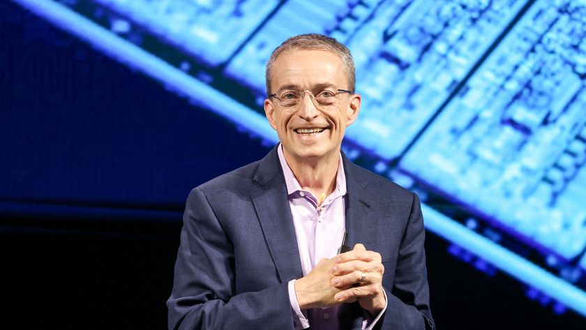 Pat Gelsinger on stage holding his hands together.