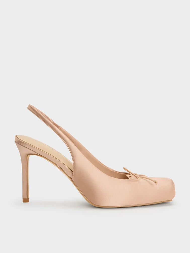 A pair of nude Charles & Keith satin heels.
