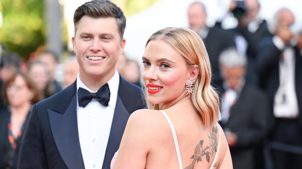 Colin Jost and Scarlett Johansson attend the &quot;Asteroid City&quot; red carpet during the 76th annual Cannes film festival at Palais des Festivals on May 23, 2023 in Cannes, France