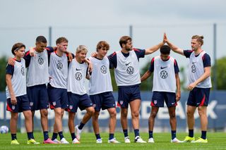 USA 2024 Olympics squad Maximilian Dietz, Axel Perez, Walker Zimmerman, Jack McGlynn, John Tolkin, Benjamin Cremaschi, Tanner Tessmann, and Nathan Harriel celebrate scoring a penalty kick during USMNT U23 training on July 11, 2024 in Bordeaux, France. (Photo by Andrea Vilchez/ISI/Getty Images)