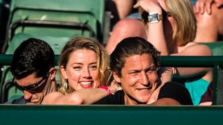 american actress AMBER HEARD and american art curator VITO SCHNABEL during day nine match of the 2018 Wimbledon on July 11, 2018, at All England Lawn Tennis and Croquet Club in London,England