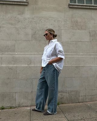 Alexis Foreman wearing an oversized button-down shirt