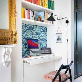 Desk in living room alcove with pull out computer desk