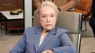 Kathy Bates sits in an office with a serious expression in Matlock S1 E15 - "Game Face."