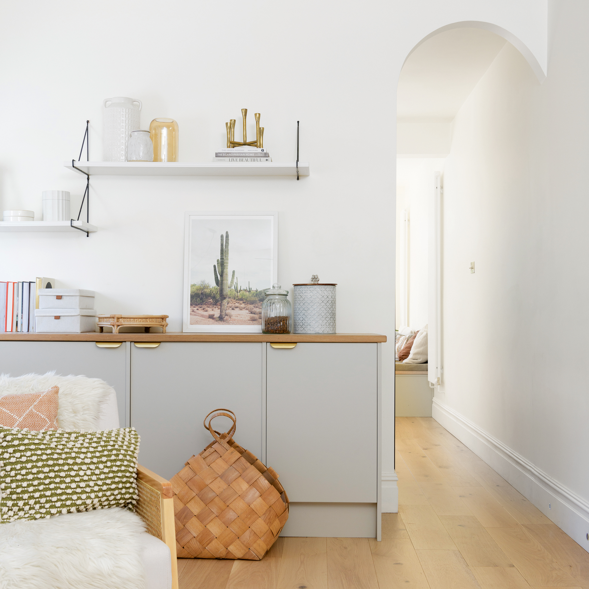 a relaxed snug with seating in the foreground and a utility area behind