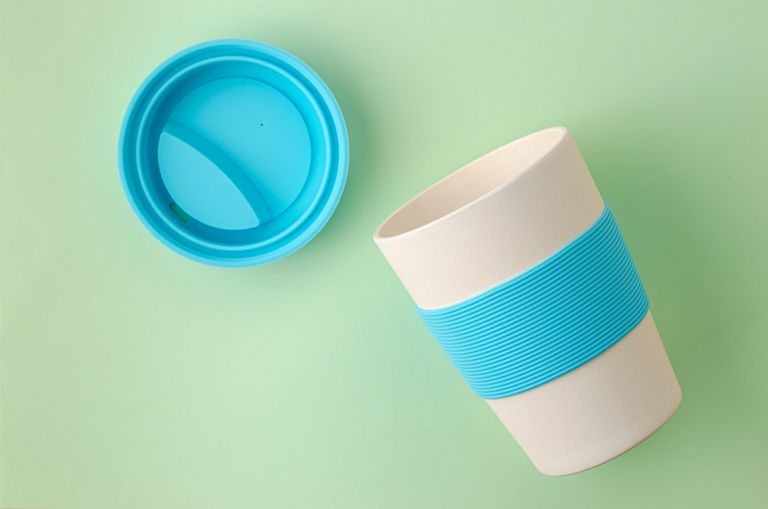 The best coffee travel mugs: Reusable resistant bamboo coffee cup. Plastic free concept. Eco friendly utensils concept