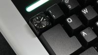 A Miyo keycap that includes a tiny watch face.