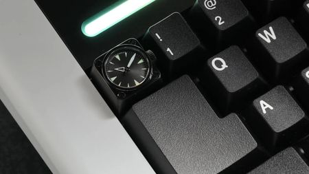 A Miyo keycap that includes a tiny watch face.