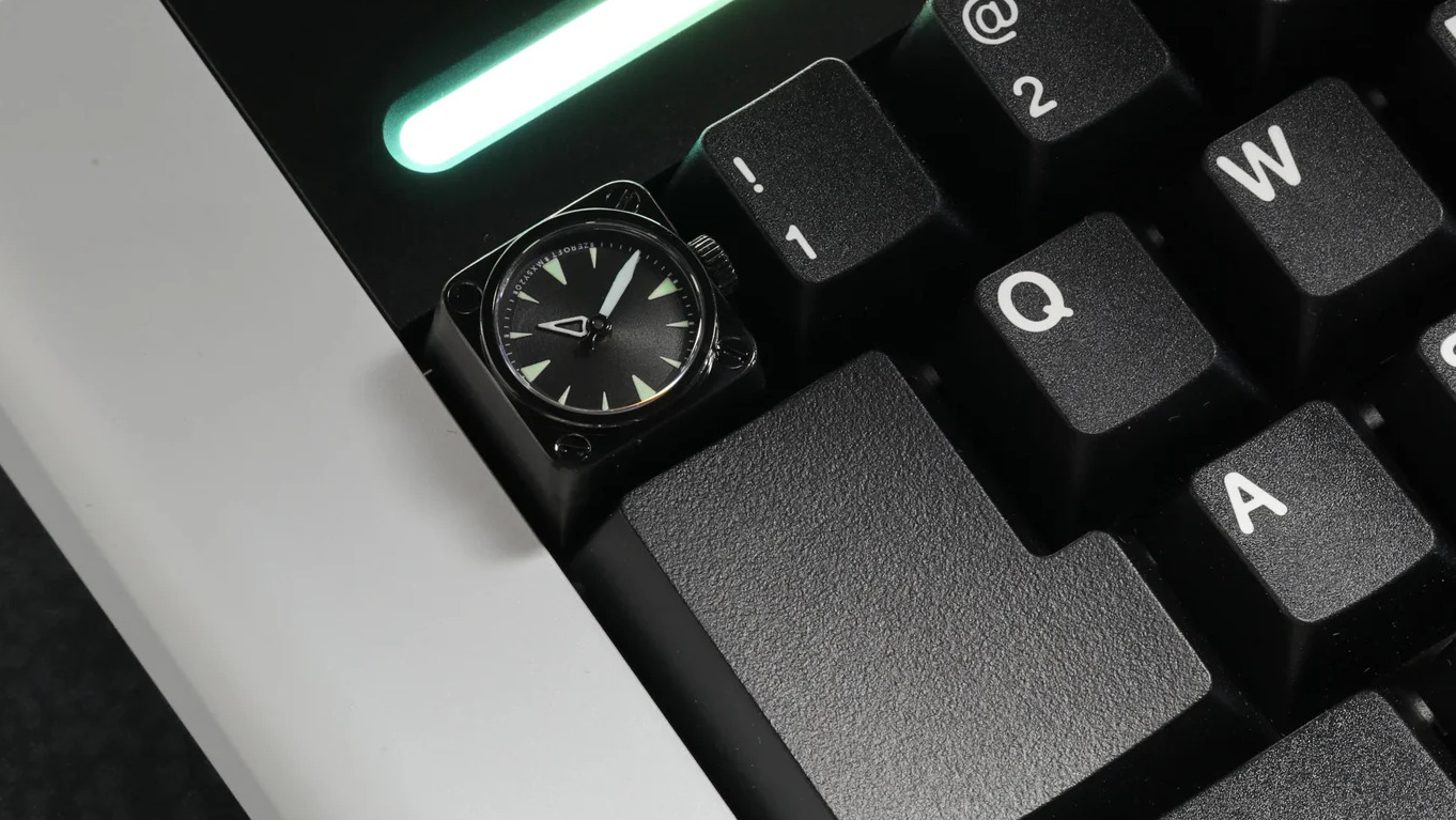 A Miyo keycap that includes a tiny watch face.