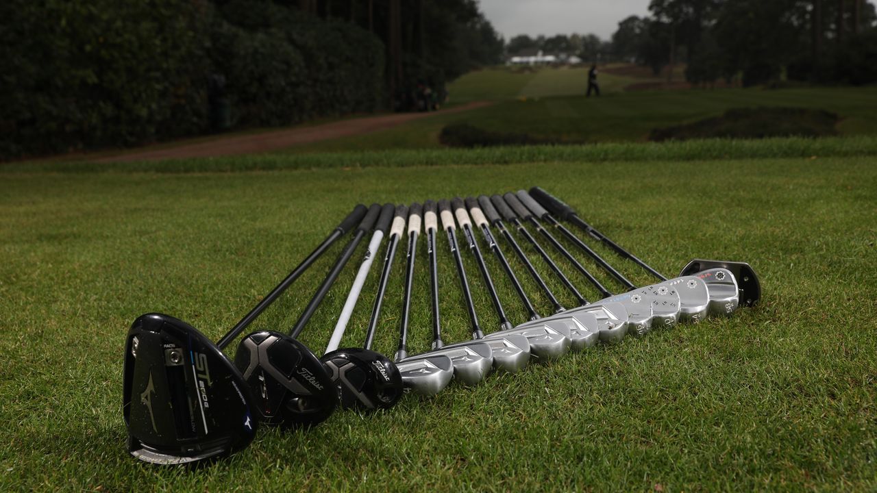 A full set of golf clubs on the tee at West Hill