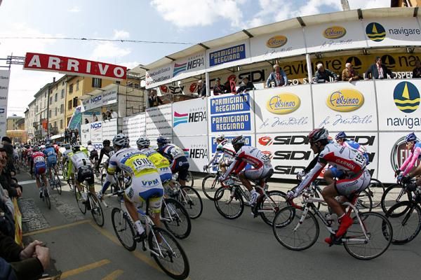 Riders roll across the finish line.