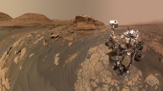 robot on dusty Martian rocks