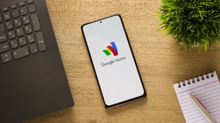 a phone with the google wallet logo on it