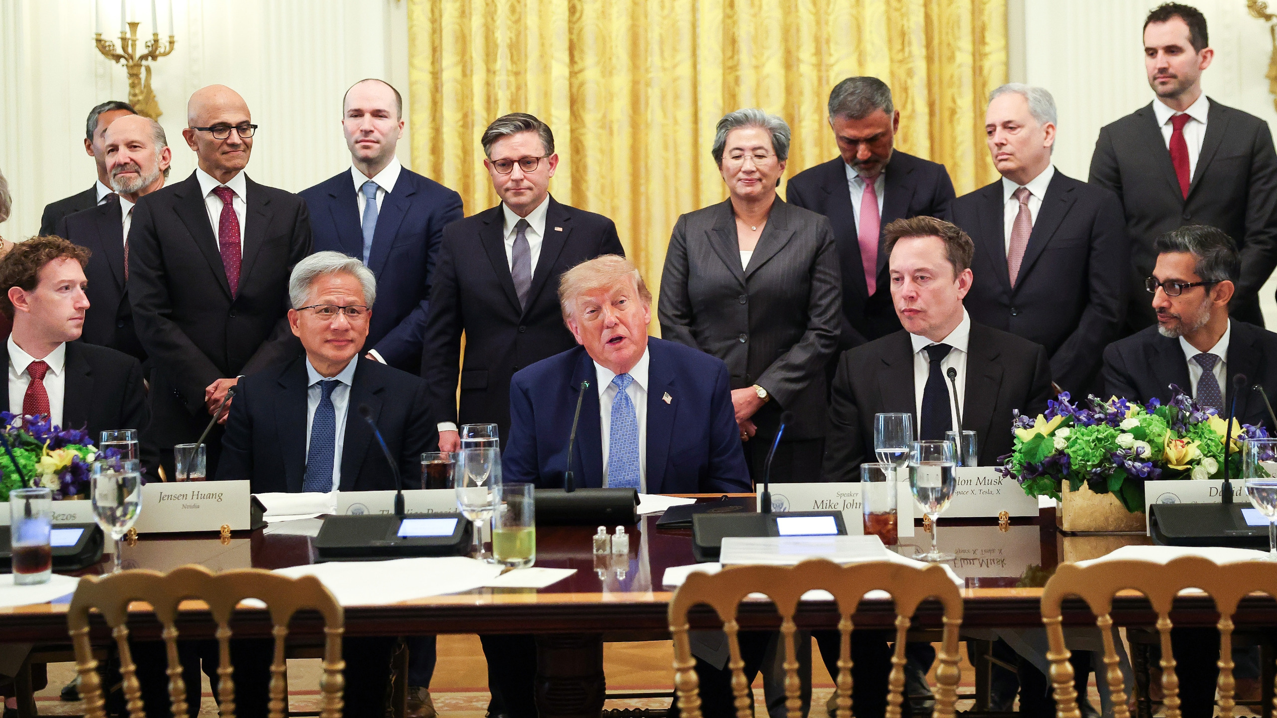 WASHINGTON, DC - SEPTEMBER 29: U.S. President Donald Trump makes a statement while he is seated with (L-R) CEO of Meta Platforms Mark Zuckerberg, Nvidia CEO Jensen Huang, Tesla, SpaceX and X CEO Elon Musk, and Google CEO Sundar Pichai during a meeting with AI executives in the East Room of the White House on September 29, 2026 in Washington, DC. The meeting comes as some have called for a slowdown in AI development amid rising safety concerns. (Photo by Kevin Dietsch/Getty Images)
