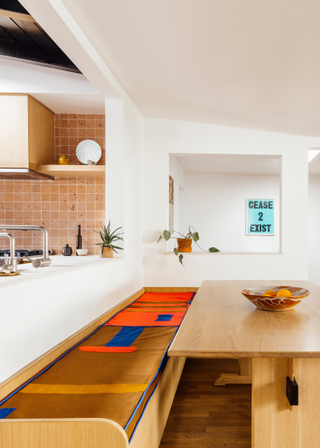 A kitchen-side dining space with wooden furnishing