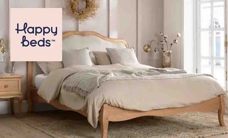 Happy Beds logo top left with bedroom of white background