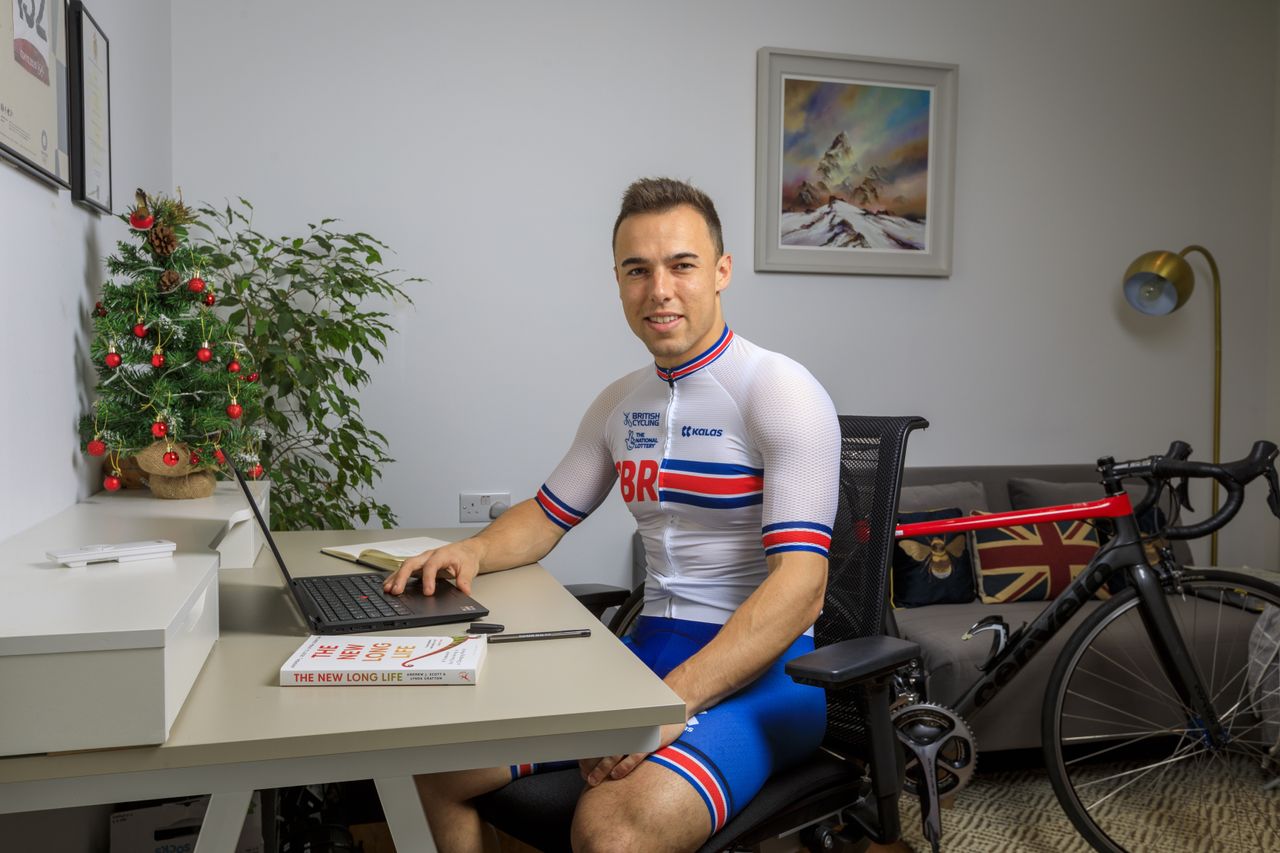 Ryan Owens at his desk on his laptop