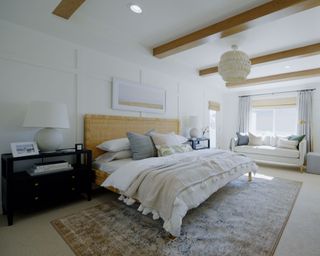 bed in neutral bedroom from dream home makeover