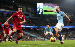 Manchester City's Sergio Aguero, right, scores against Liverpool in January