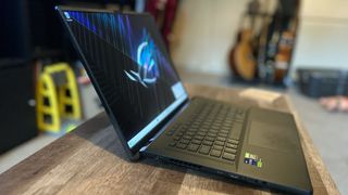 Asus ROG Zephyrus M16 gaming laptop from left side showing hinge and ports