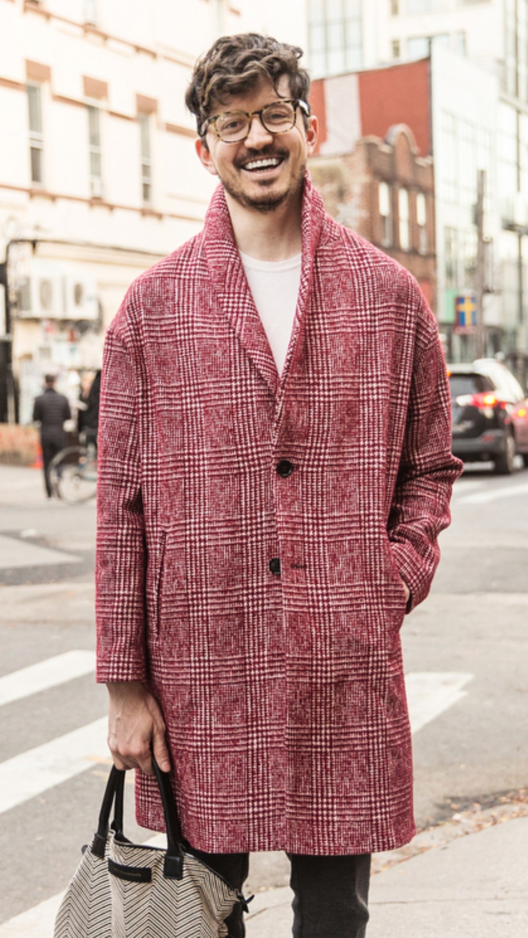 a white man with brown hair in a red coat