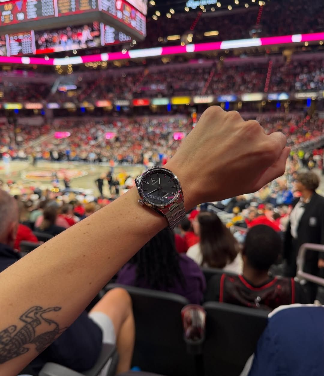 Eliza Huber showing off her TAG Heuer Carrera Date watch at the Indiana Fever game in Indianapolis.