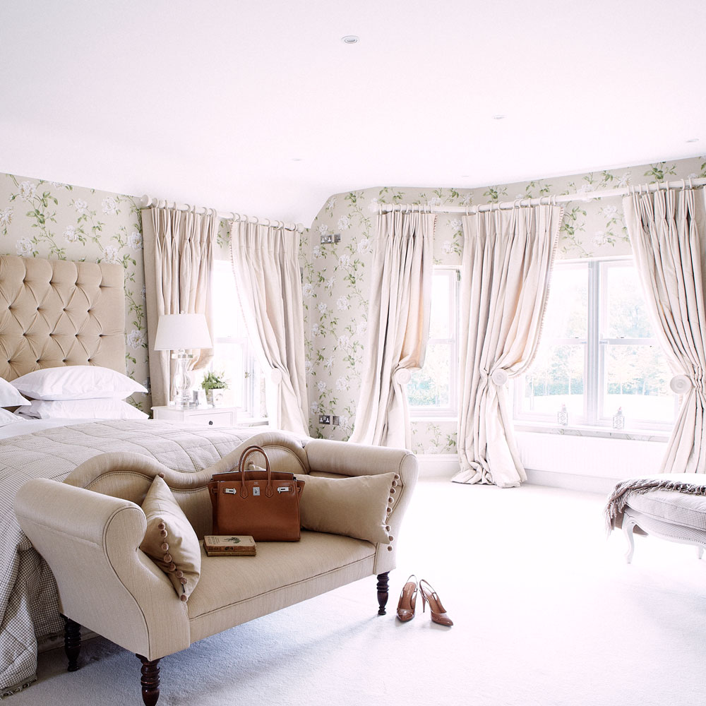 room with pink wall and curtains