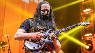 John Petrucci of Dream Theater plays an electric guitar