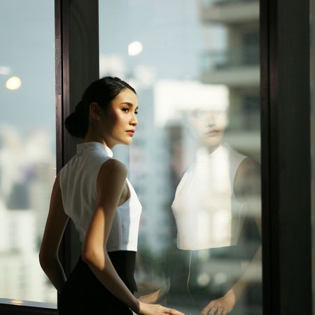 Woman Looking Out of Window