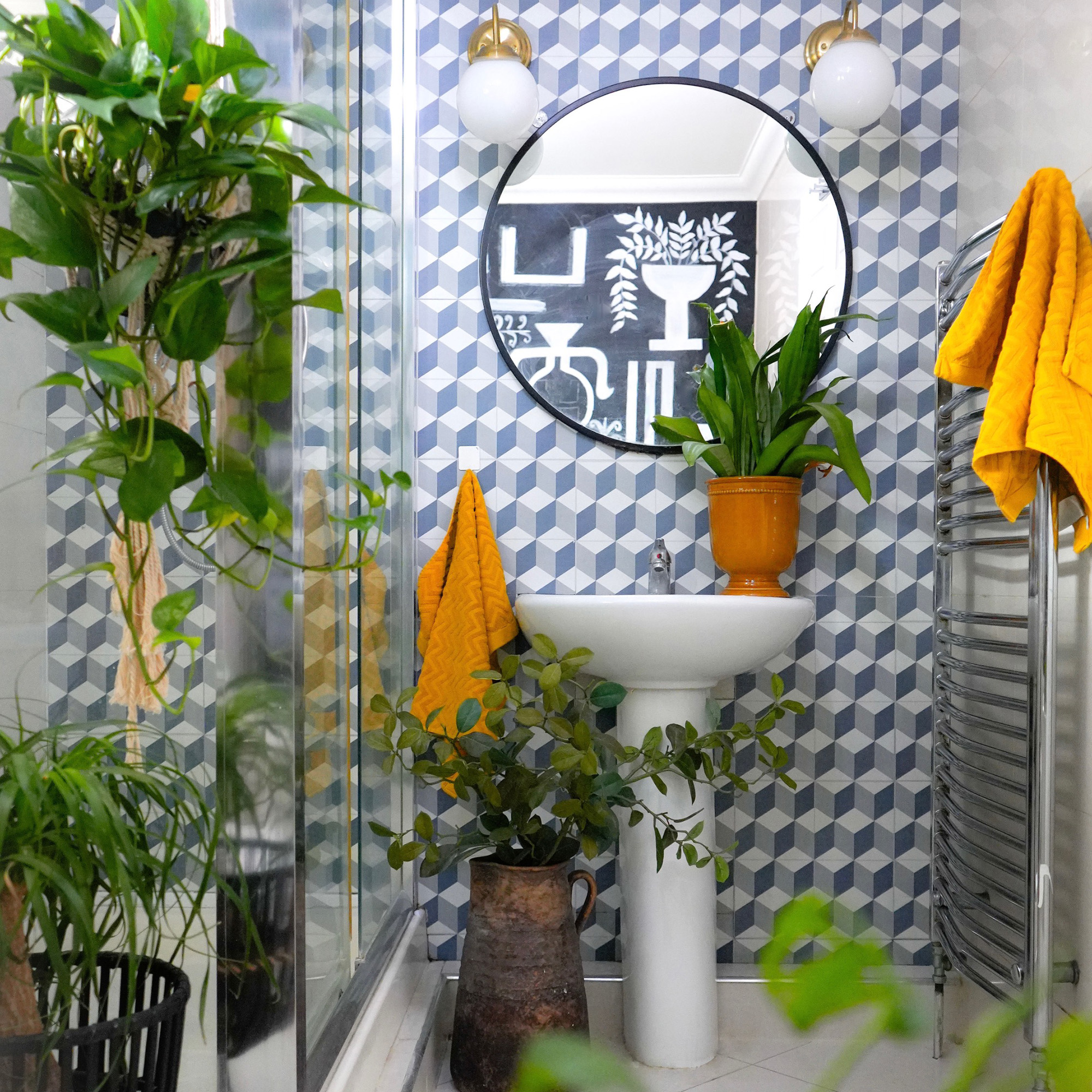 bathroom with blue geometric patterned tiles on the wall