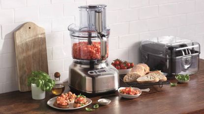 Lifestyle image of the Sage the Paradice 16 food processor surrounded by bowls of food