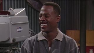 Screenshot of Martin Lawrence's Martin Payne squinting and smiling at Notorious B.I.G. in Martin Season 4