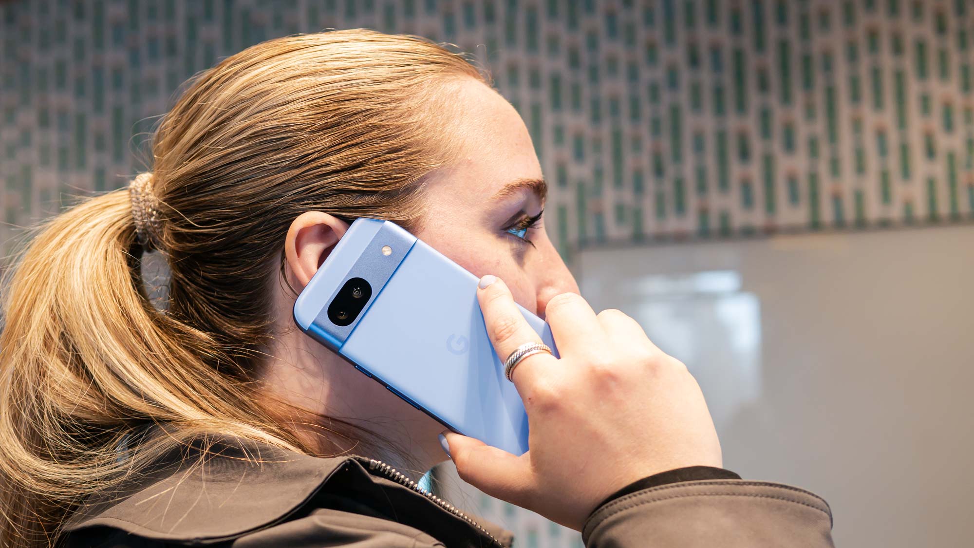 Tom's Guide editor Kate Kozuch making a phone call with Pixel 8a.