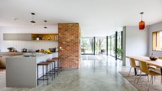 open plan kitchen diner with polished concrete floor