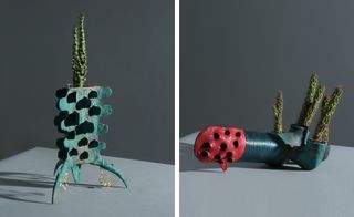 Two abstract plant pots holding succulents resembling a rocket and submarine