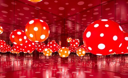 Yayoi Kusama ‘You, Me and the Balloons’ exhibition at Aviva Studios featuring spotty, bright inflatables