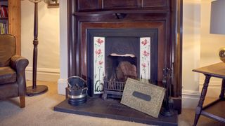 Fireplace with Chinmey Sheep draught excluder to show how to keep your house warm in winter for less
