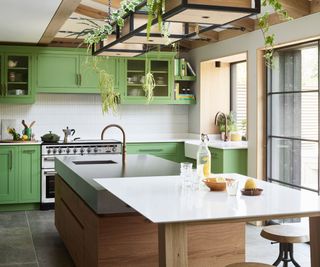 Green and white kitchen with large island